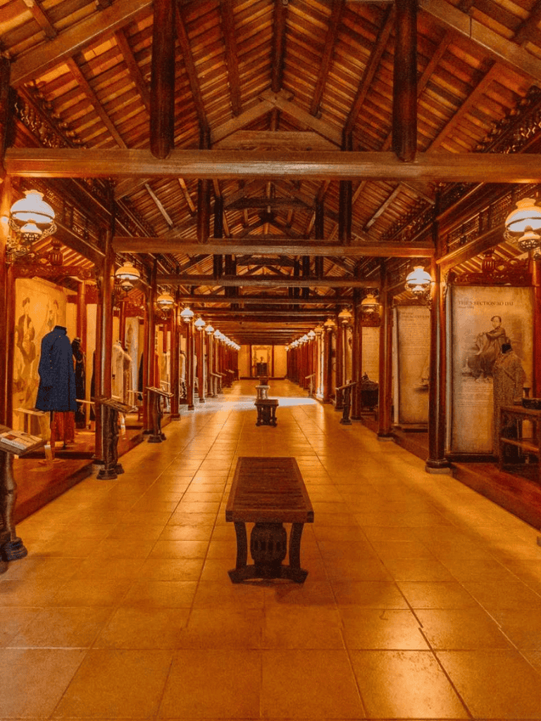 Vintage museum interior showcasing wooden architectural details and historical artifacts.