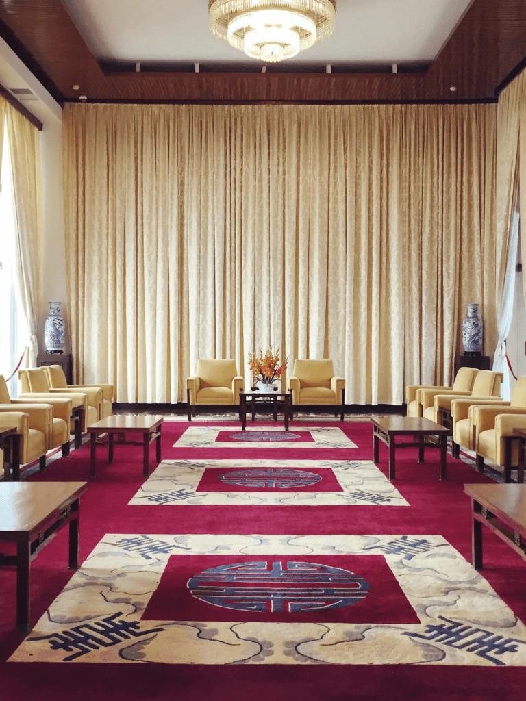 Elegant conference room with traditional decor and plush seating for business meetings and events.