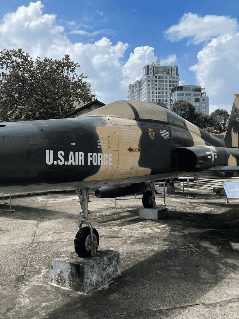 U.S. Air Force fighter jet on display at Quest for Directions exhibit in an outdoor museum.