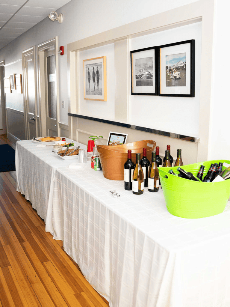 Bottle wine and drink station at a social gathering or event.