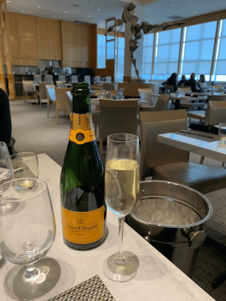 Celebrate comfort and luxury at QuestForDirections with champagne in a stylish, modern dining setting.