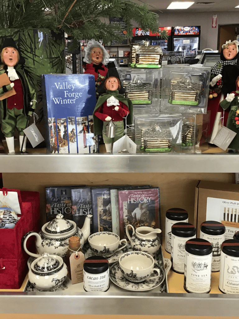 Festive holiday dolls and ornaments display at QuestForDirections holiday shop, featuring Christmas collectibles and seasonal decor.