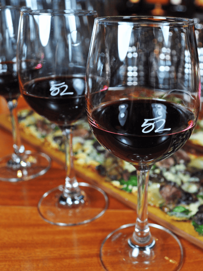 Rich Red Wine in Clear Glasses for Tasting and Dining.