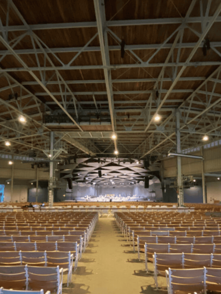 Modern concert hall interior with seating and stage setup.