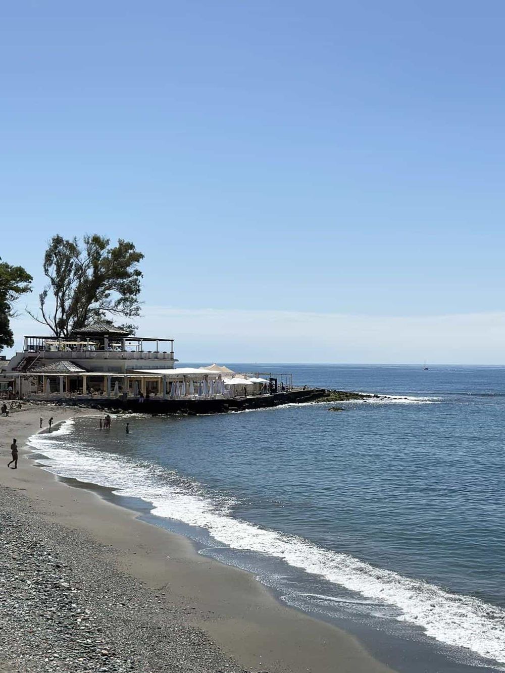 Seaside restaurant with ocean view and beach outdoor dining experience.