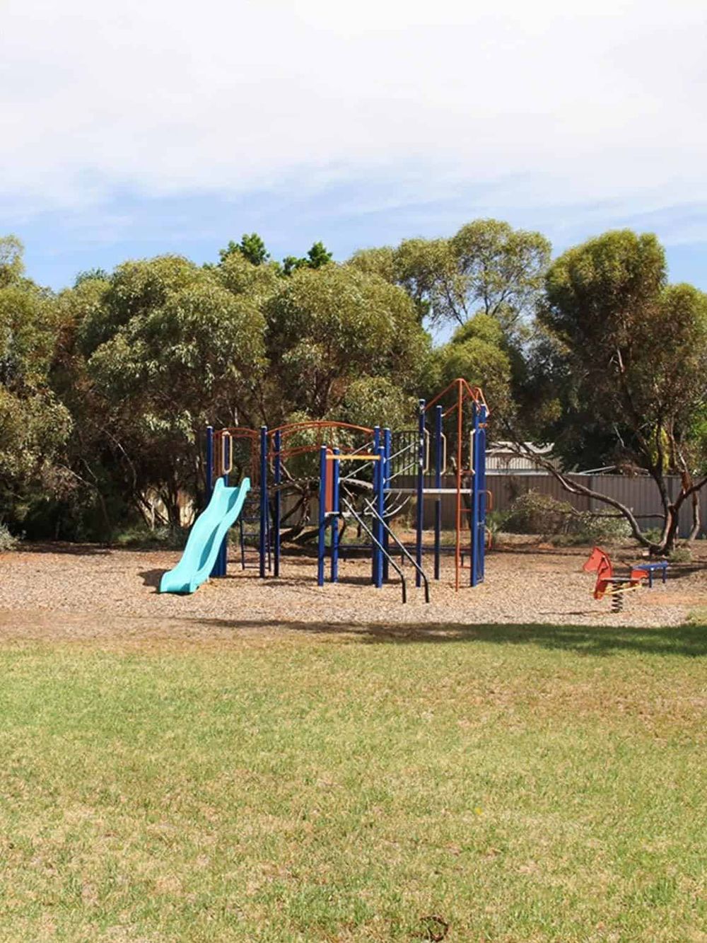 Colorful playground equipment at a local park in QuestForDirections neighborhood.