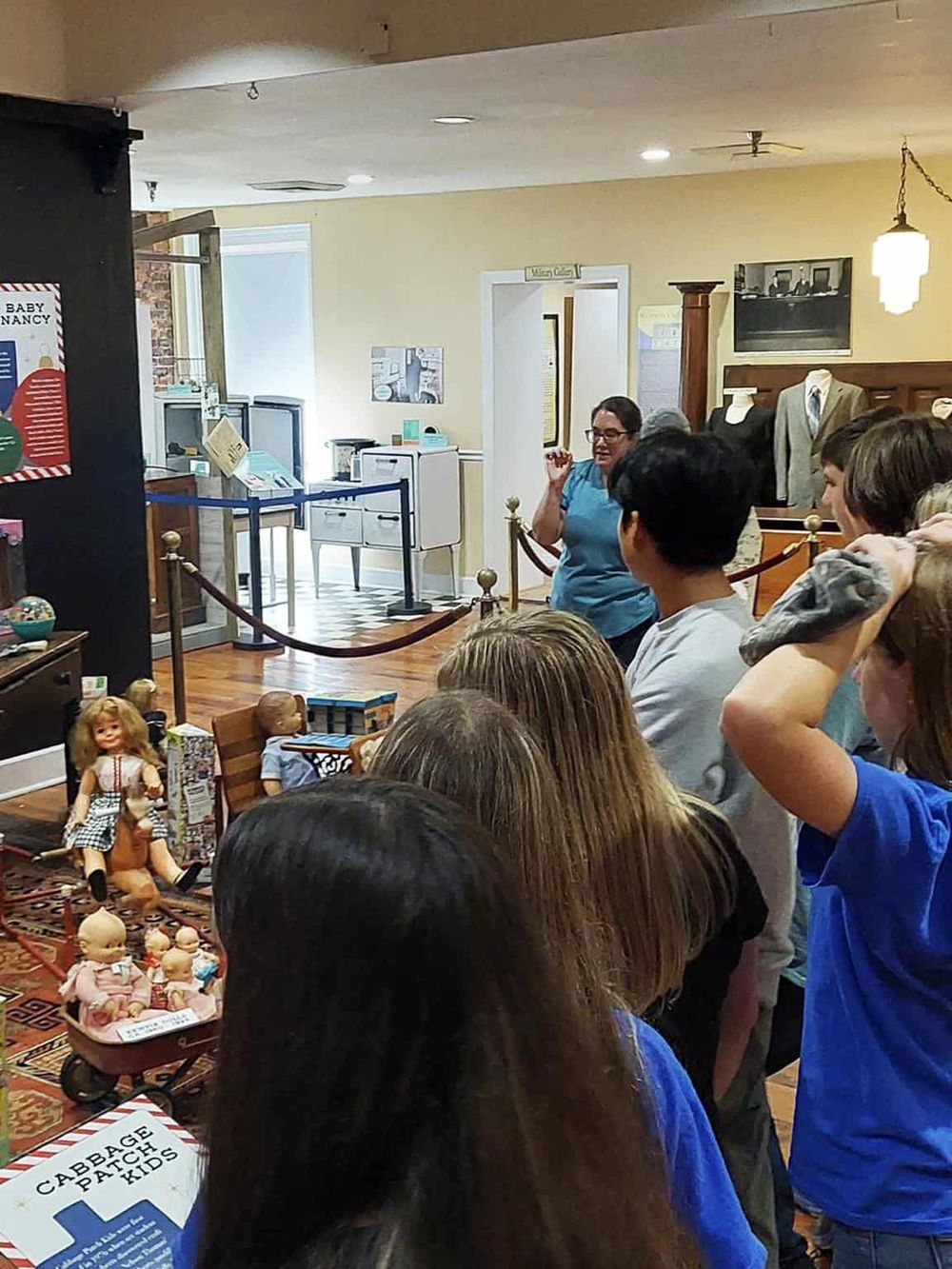 1. Children and adults listening to a storyteller at the Children's Museum.