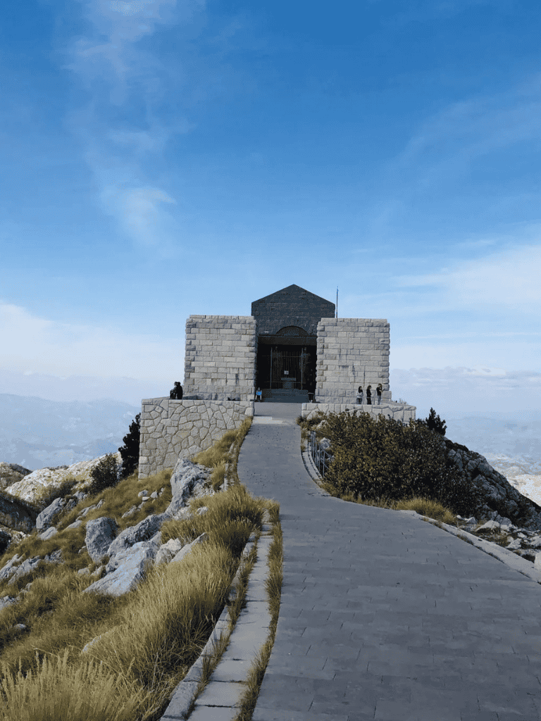 Historic mountain shrine accessible by scenic trail for travel and adventure enthusiasts.