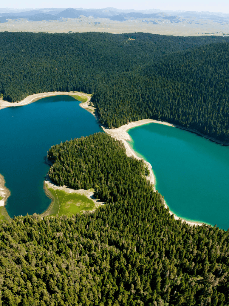 Tranquil forest landscape with two scenic lakes and lush greenery, perfect for outdoor exploration and nature photography.