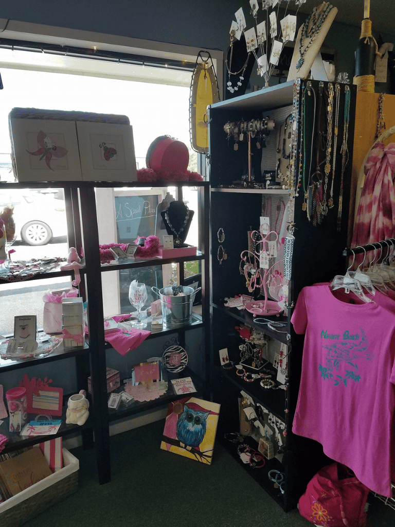 Pink jewelry and gift boutique display at QuestForDirections, offering stylish accessories and unique gifts.