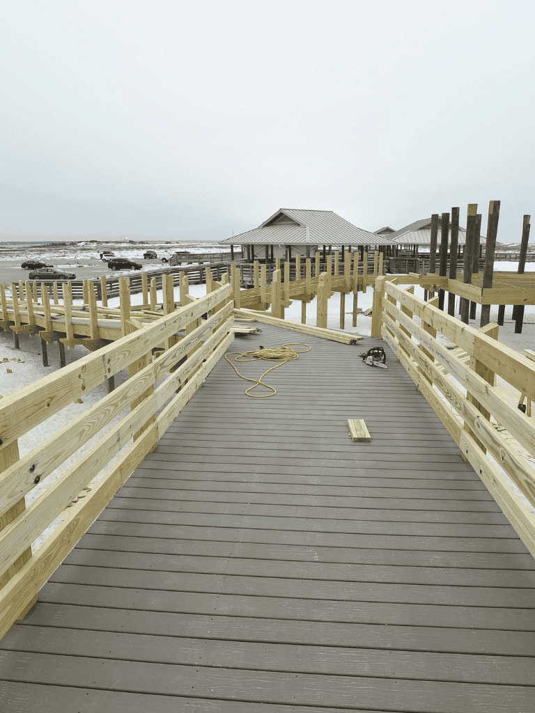 1. Wooden beachfront walkway under construction at coastal destination.
