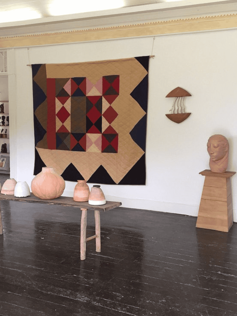 Geometric wall art and rustic decor in cozy interior space.