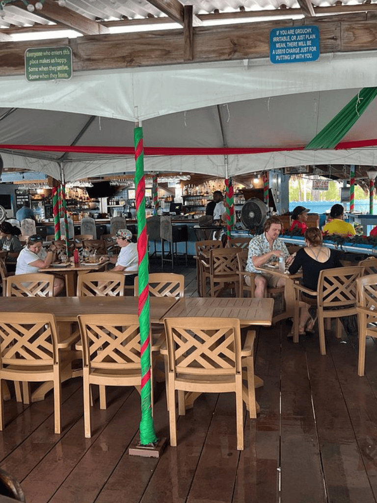 Everyone enjoying a cozy indoor dining area at QuestForDirections restaurant with festive decor and relaxed atmosphere.