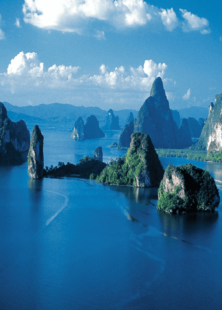 Stunning landscape of limestone karsts and emerald waters in Vietnam’s Halong Bay.