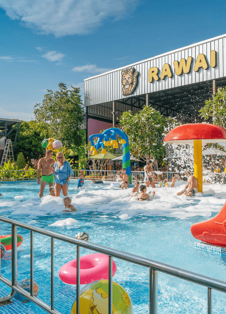Colorful water park with slides and foam, family-friendly destination at Rawai.