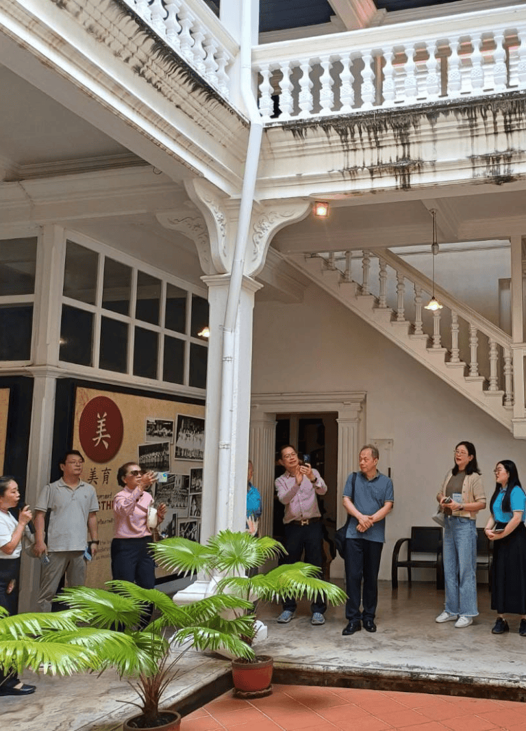 An elegant historical building with a group of tourists guided inside, showcasing QuestForDirections expert tour services.