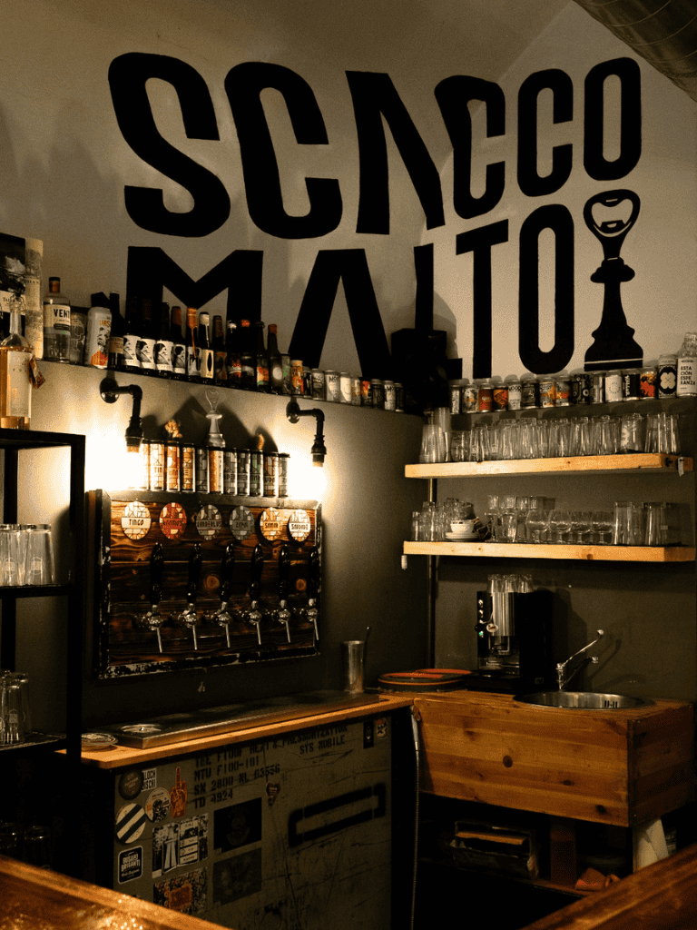 Craft beer tap wall at a cozy bar in Soho, emphasizing craft beer and nightlife.