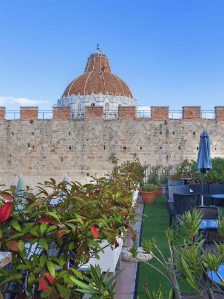 Historic tower with terracotta dome in Florence, Italy.
