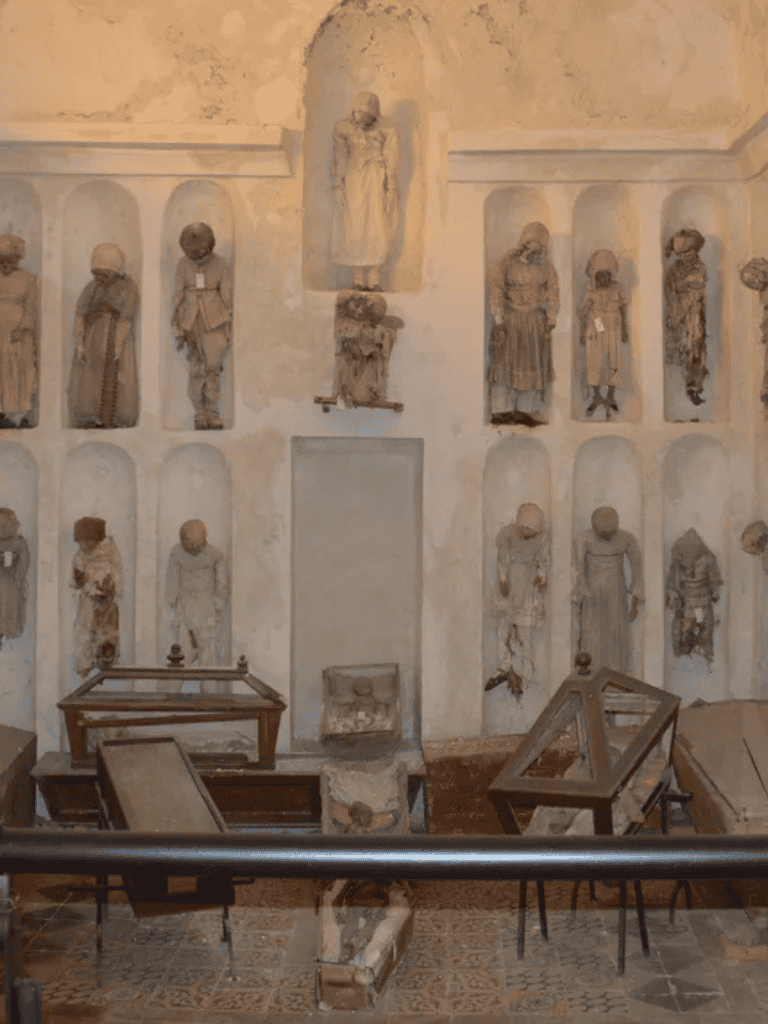 Ancient Christian relics displayed in a historic museum with stone sculptures and artifacts.