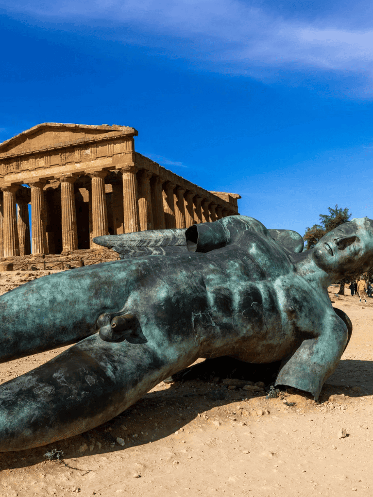 Ancient Greek sculpture and Parthenon ruin in Athens, Greece, showcasing classical history and architecture.