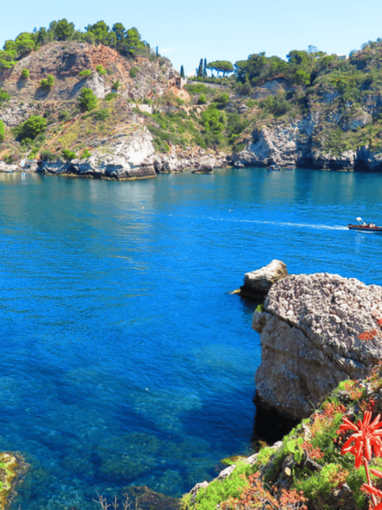Stunning coastal cliffs and turquoise waters at QuestForDirections scenic location in Italy.