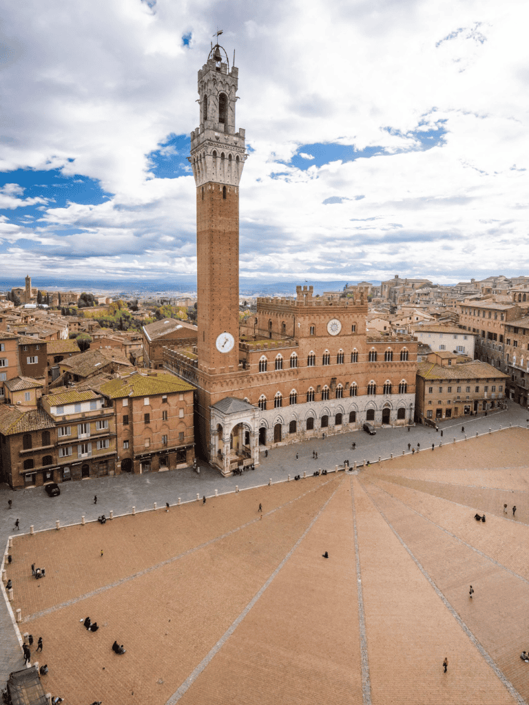 Ancient Italian tower with city views, Piazza del Campo in Siena, Italy.