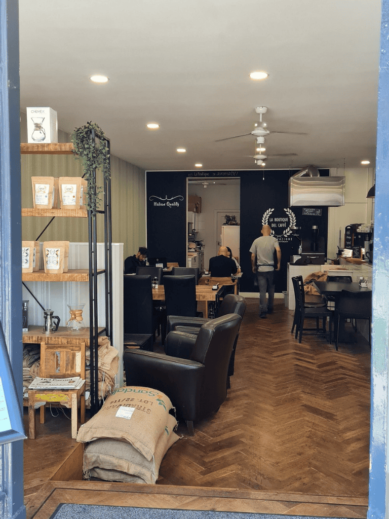 Cozy coffee shop interior with modern decor, seating area, and café ambiance, perfect for relaxing or working.