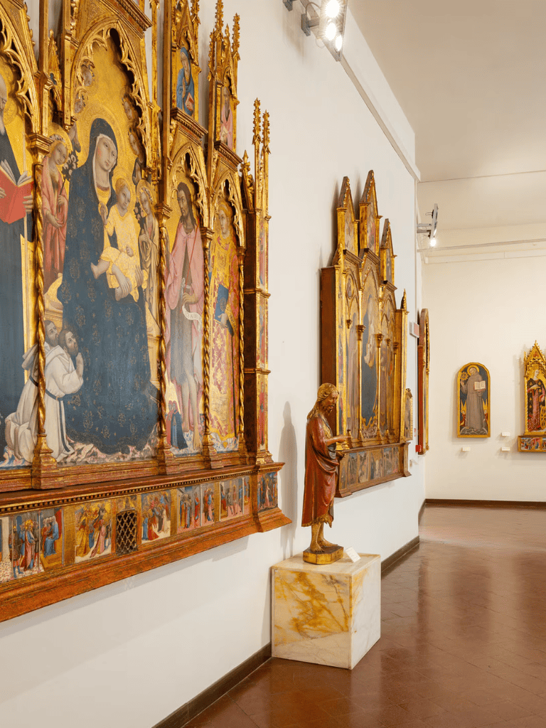 Intricate religious artwork and sculptures in a historic church or museum exhibit.