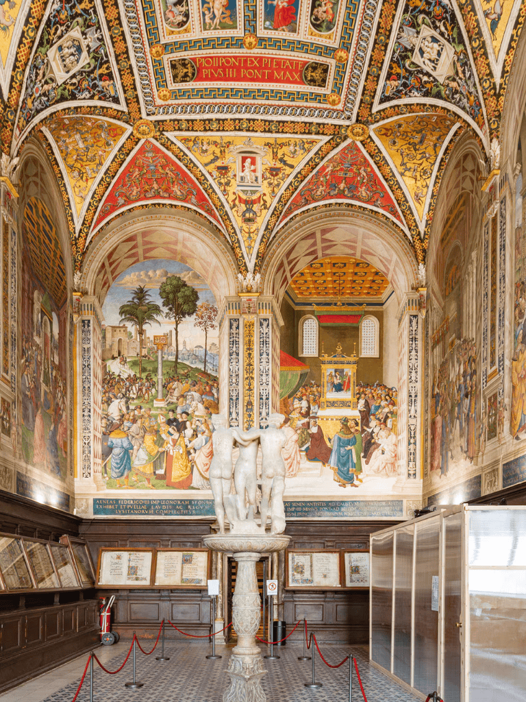 Vatican Museum interior with historic frescoes, sculptures, and ornate architecture for cultural travel.