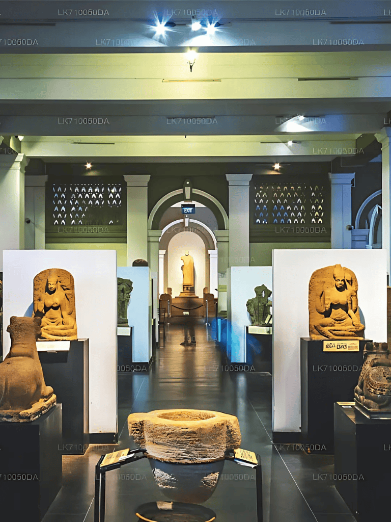 Ancient artifact display inside museum showcasing historic sculptures and relics.
