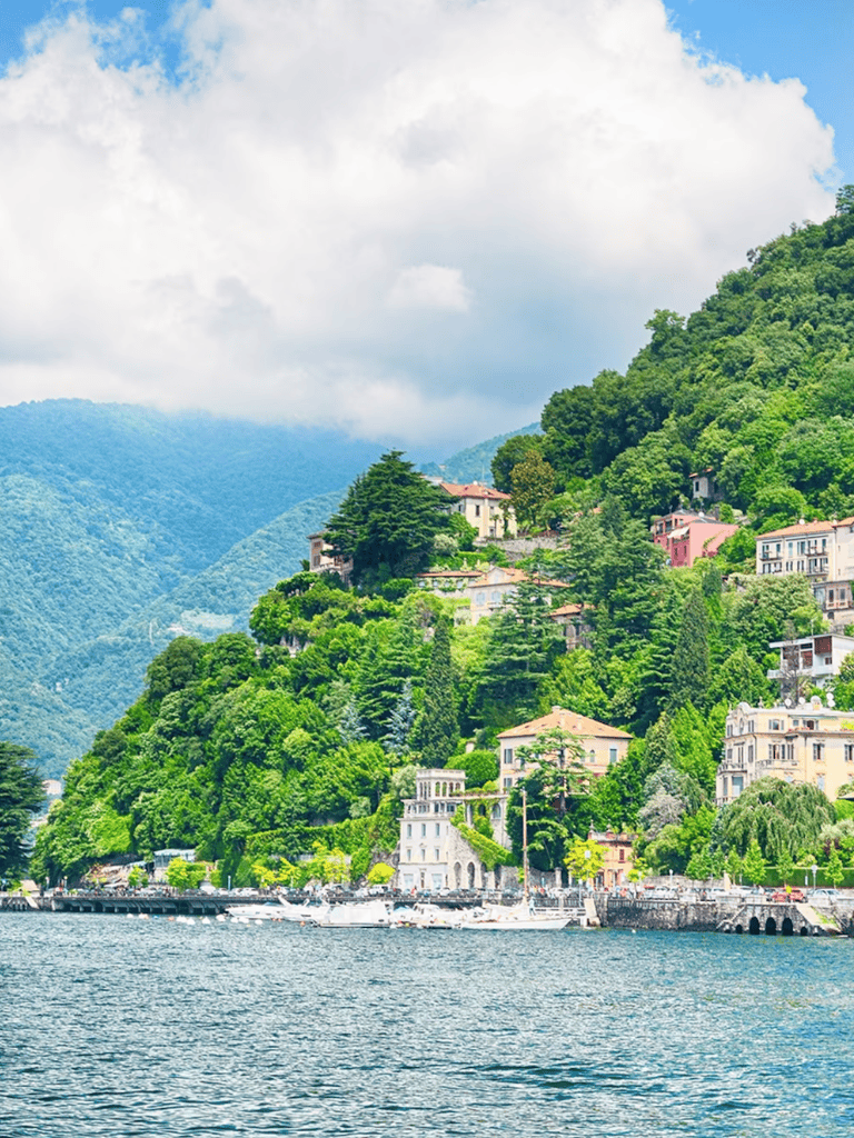Panoramic view of Lake Como with lush green hills and elegant villas, perfect for travel planning and scenic explorations.