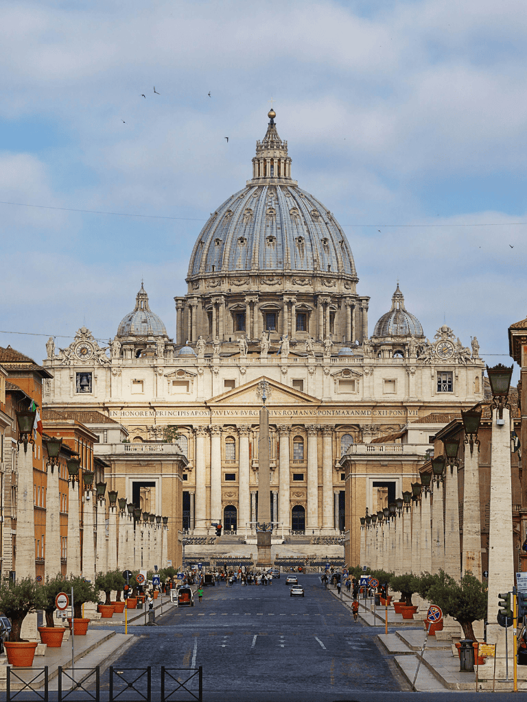Ancient Rome St. Peter's Basilica in Vatican City, Italy, during daytime with clear blue sky.