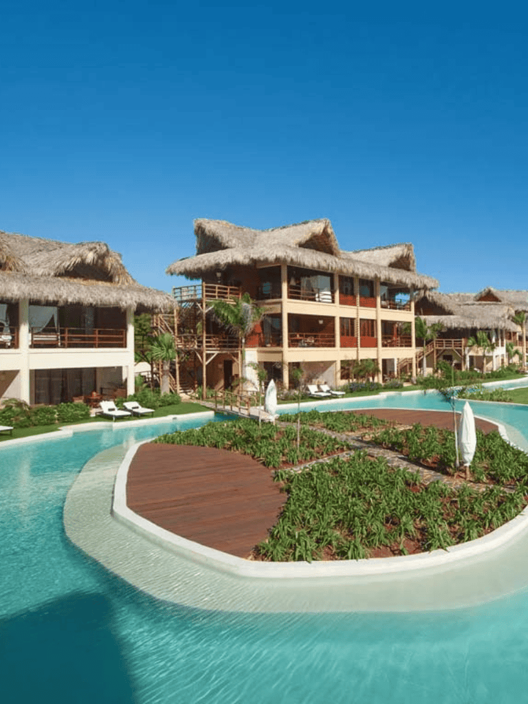 Luxurious tropical resort with thatched-roof villas and infinity pools, perfect for a relaxing vacation.