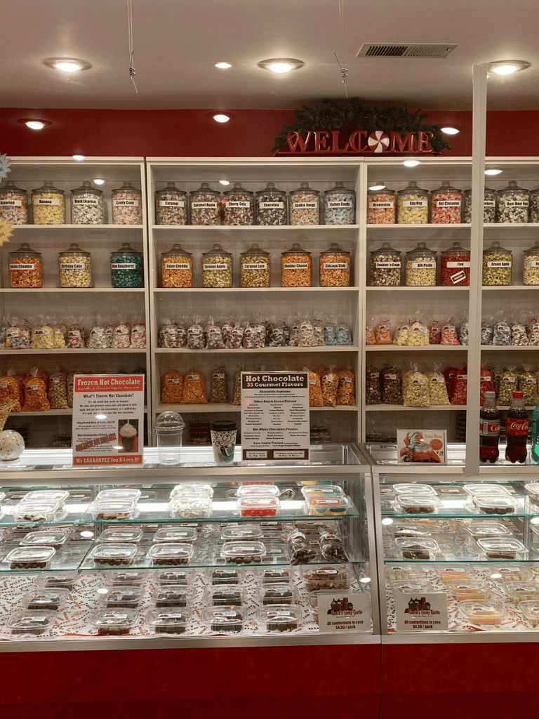 Miniature candy and hot chocolate display at QuestForDirections, a cozy sweets shop with a wide variety of flavors and treats.