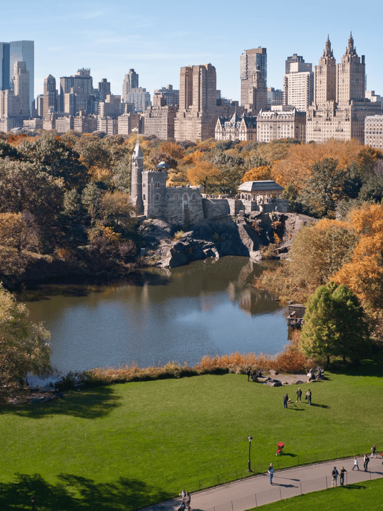 Scenic view of Central Park with city skyline and autumn trees in New York City.