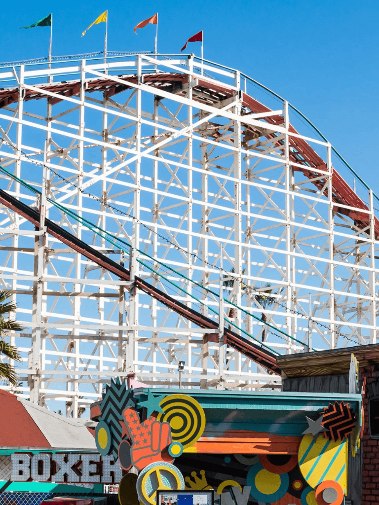 Thrilling wooden roller coaster at Quest for Directions amusement park, exciting ride and family fun destination.