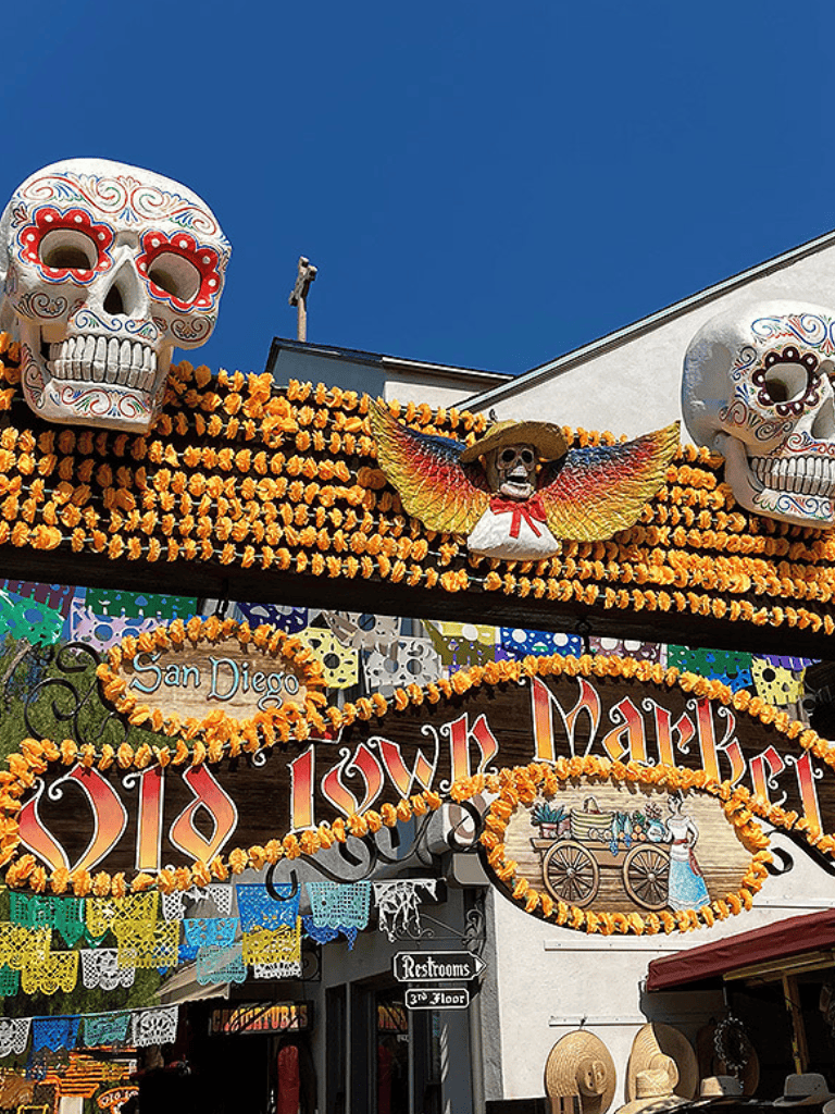 Colorful Día de los Muertos decorations with vibrant skulls and marigolds in San Diego.