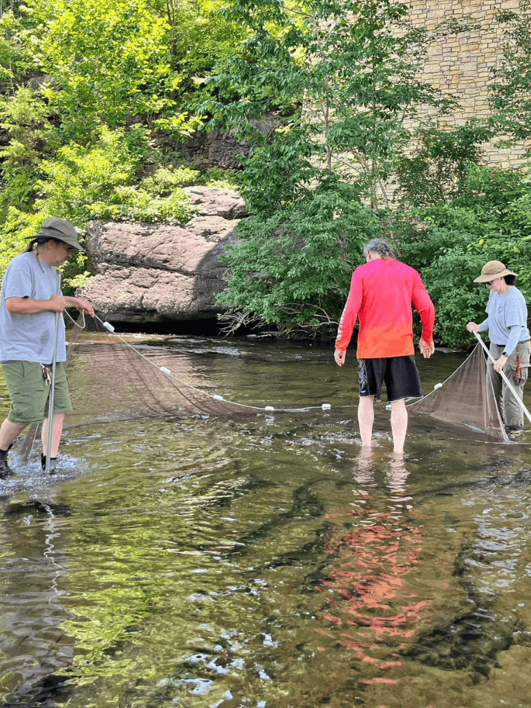 Seine river research in nature with people fishing or sampling water quality for environmental studies.