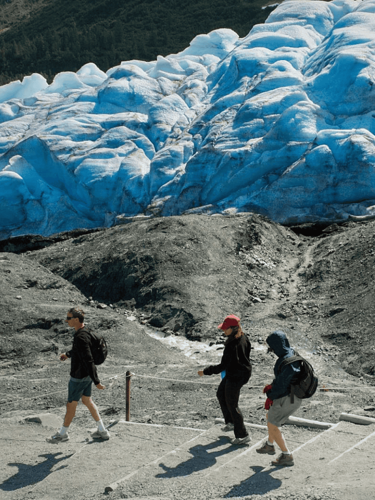 Dense glacier with travelers hiking, outdoor adventure, scenic glacier view, QuestForDirections.