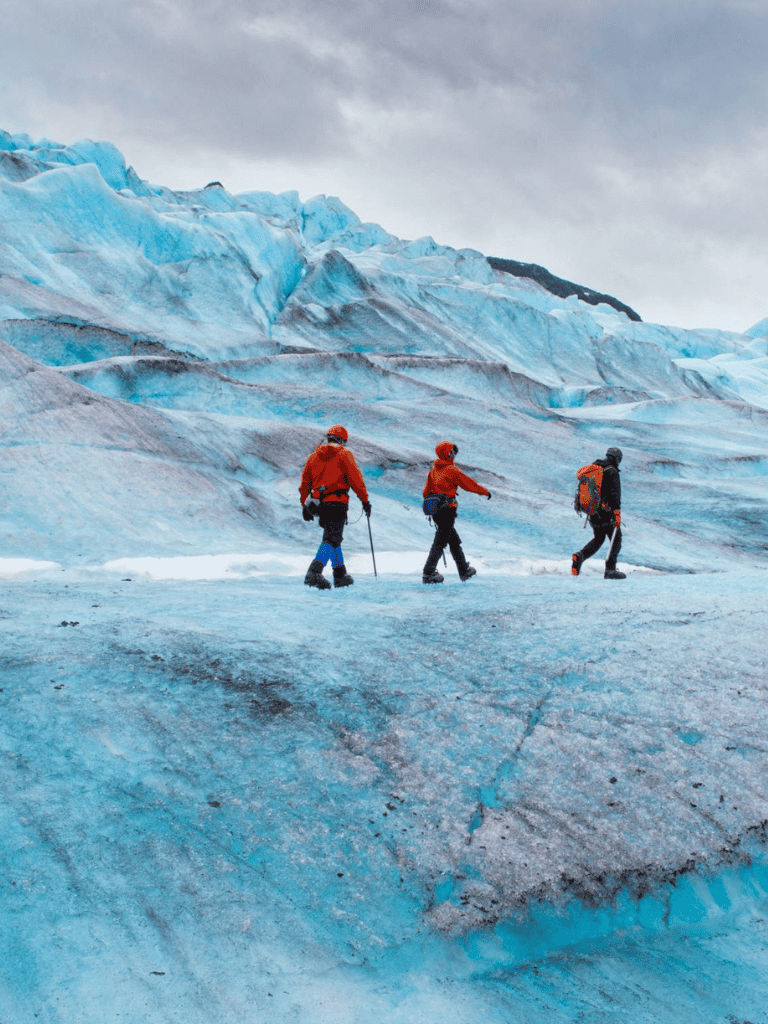 Alpine glacier exploration with hikers, adventure travel, and guided tours.