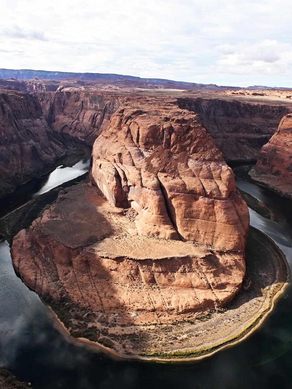 Stunning aerial view of Horseshoe Bend in the Colorado River, a famous natural landscape in Arizona.