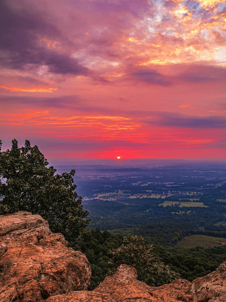 Sunset over scenic landscape from mountain viewpoint at QuestForDirections.