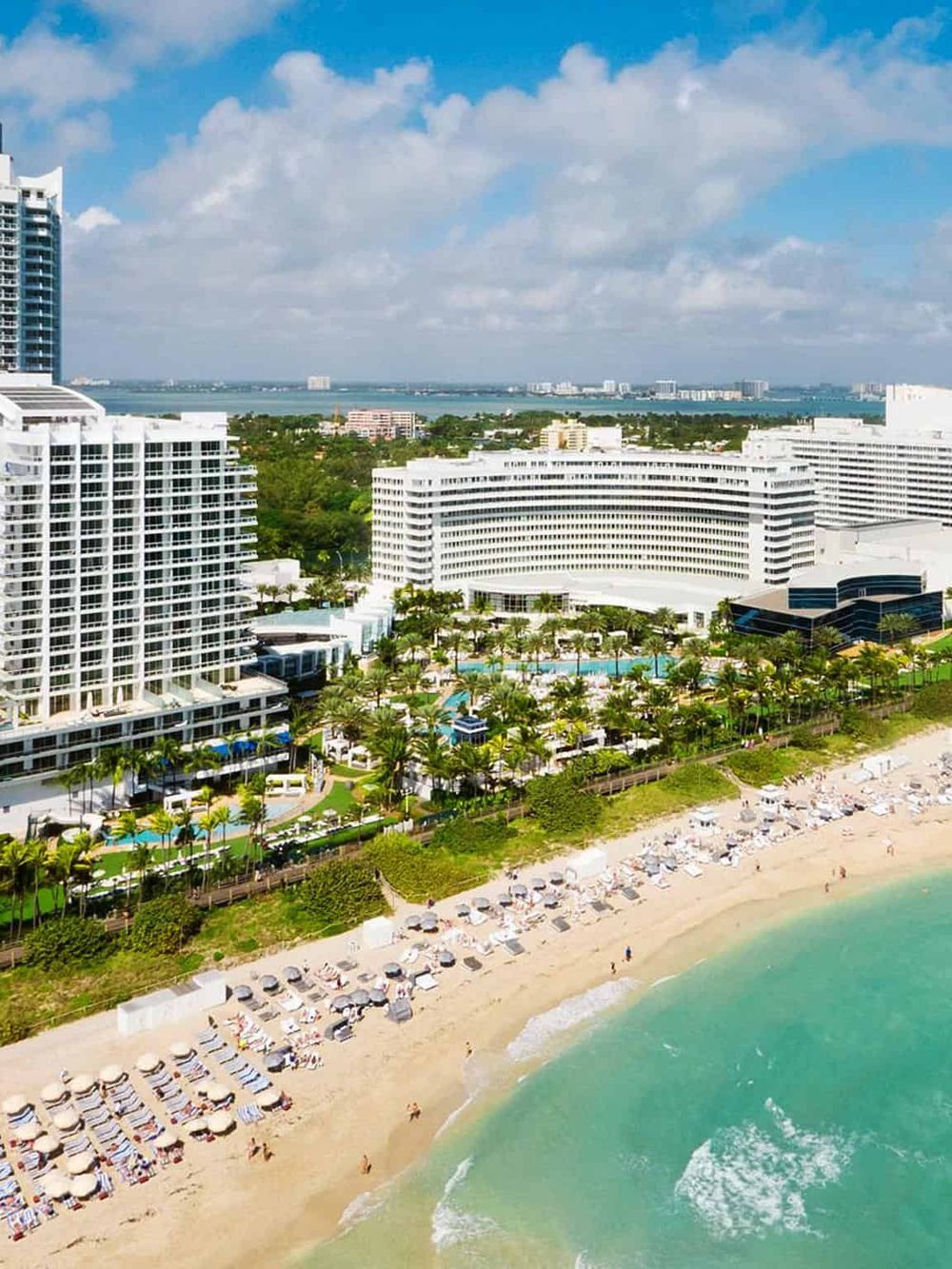 Luxury beachfront resort with ocean views, swimming pool, and private beach access.