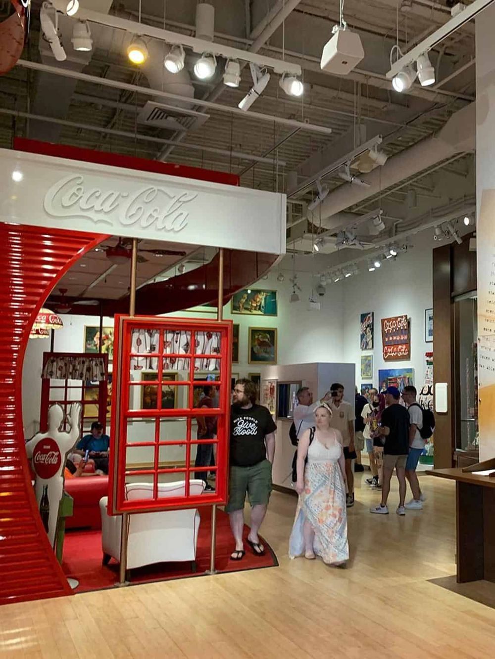 Bright Coca-Cola themed display at the retail store, attracting visitors with vibrant colors and nostalgic branding.