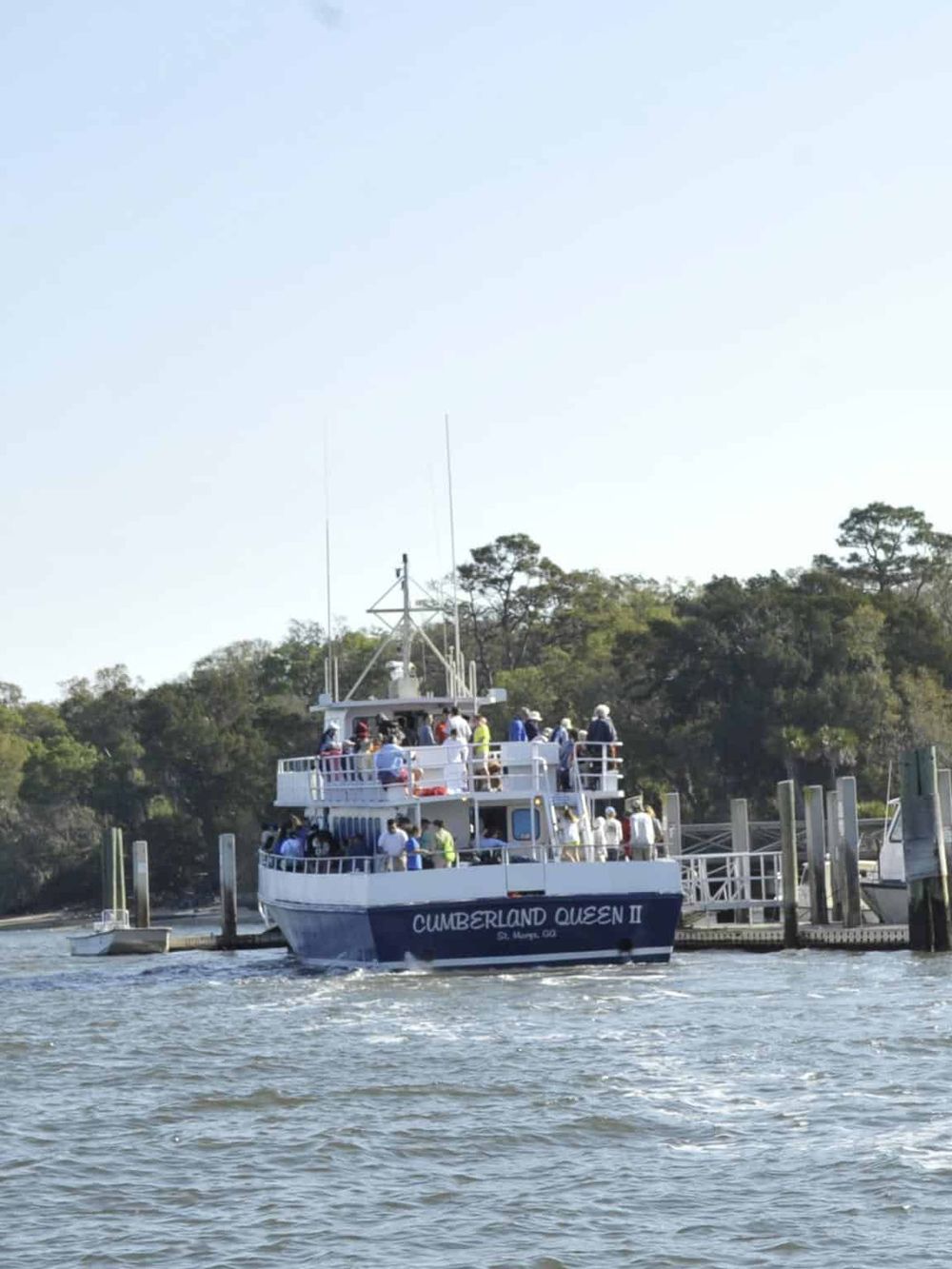 Greatest natural beauty tour boat on water with passengers, exploring scenic waterways.