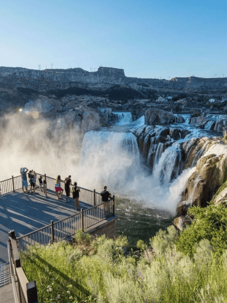 Breathtaking view of Niagara Falls with visitors enjoying the scenic waterfall observation platform.