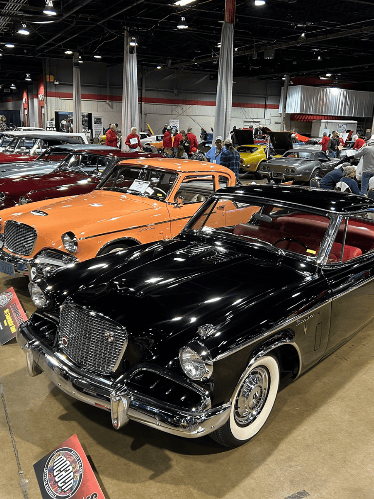 Vintage classic cars at the QuestForDirections auto show showcasing rare vehicles and automotive history.