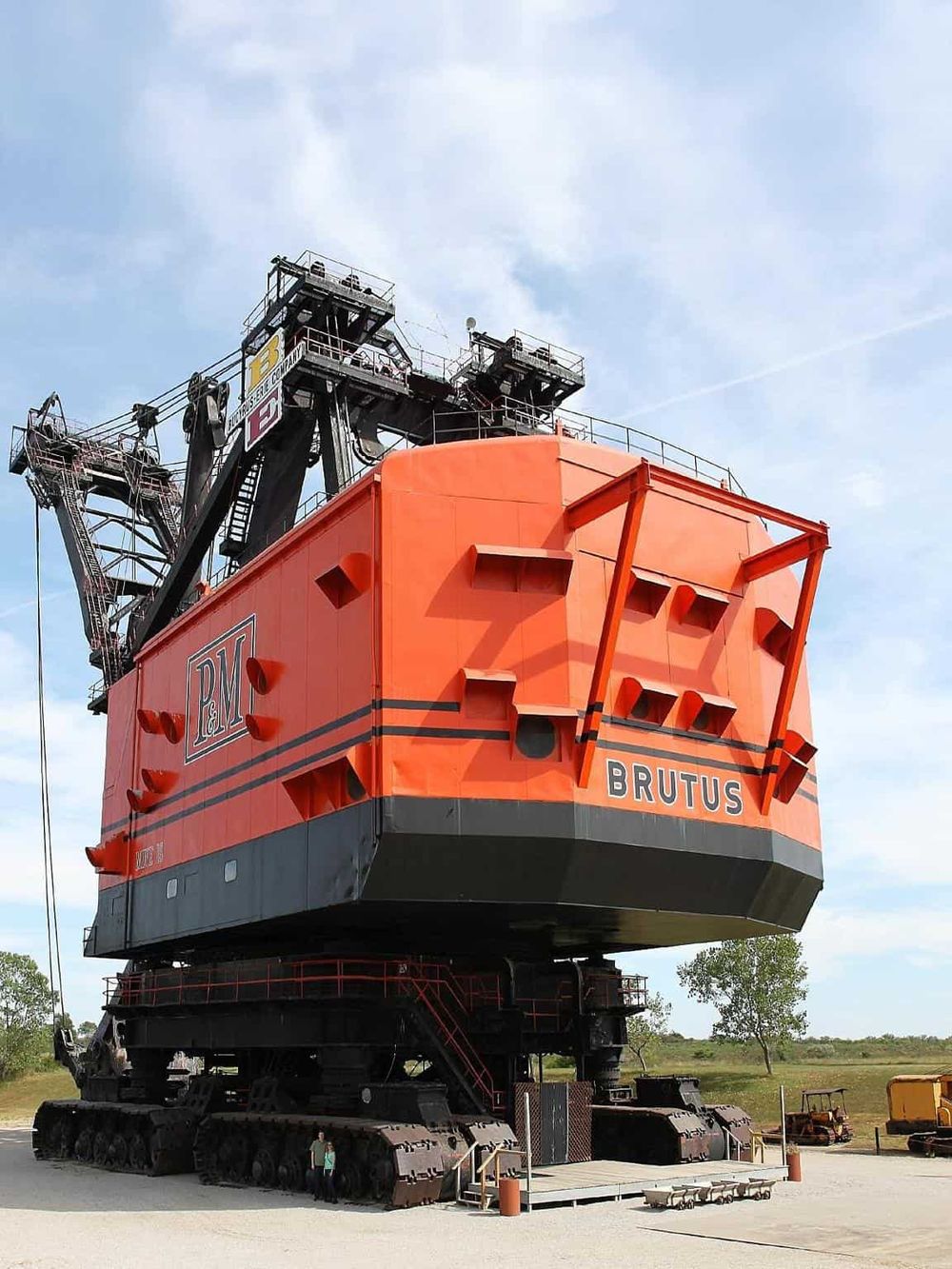 Industrial mining ship replica in an outdoor museum setting.
