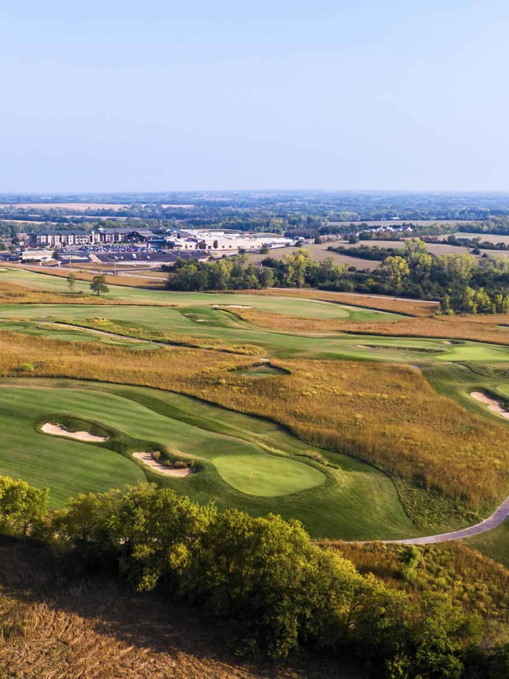 Vibrant golf course landscape with lush fairways and scenic surroundings in a sprawling outdoor setting.