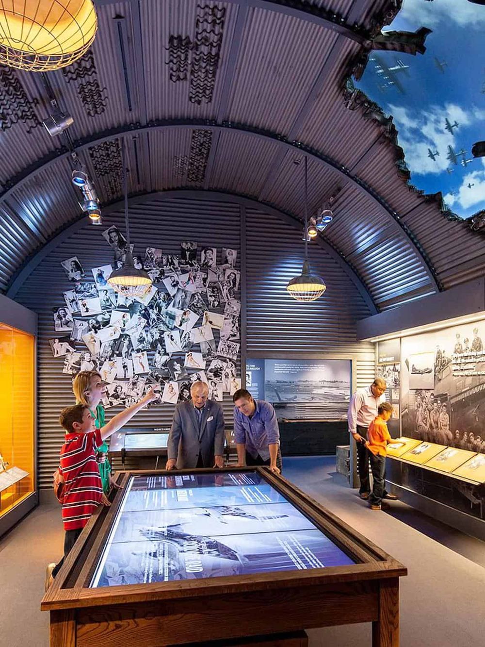 Interactive museum exhibit with photos and historical displays about aviation history.